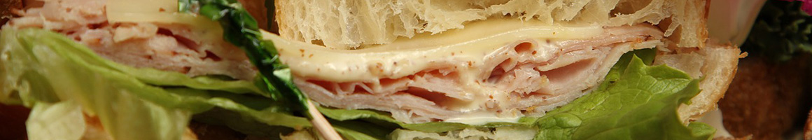 Eating Deli Sandwich at Bunny Deli restaurant in New York, NY.